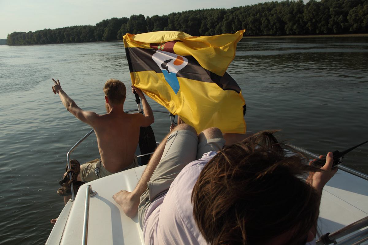 LSA member Yoshi Livo holding the Liberland flag on the Danube